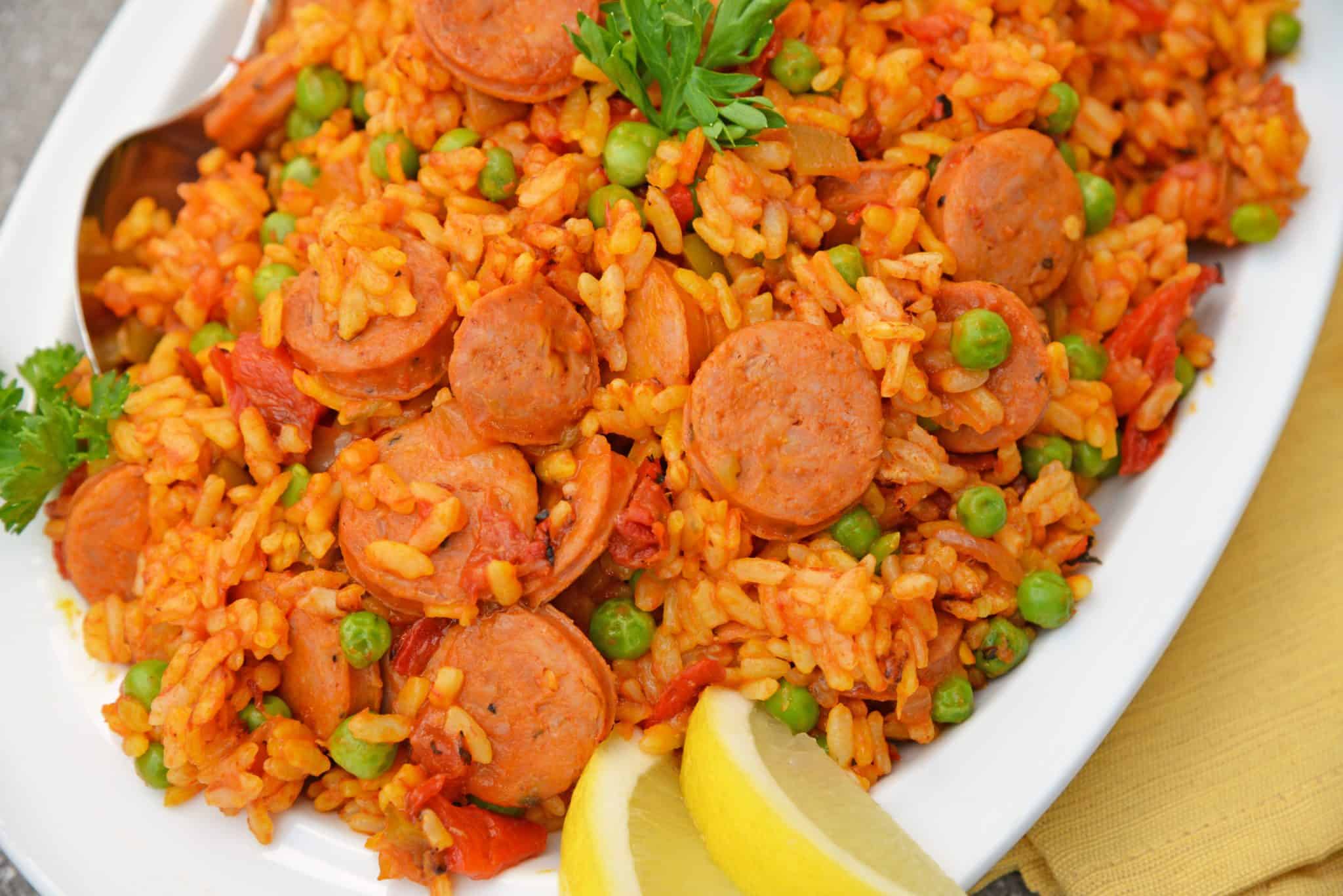 Instant Pot Chicken Paella is based off the traditional Spanish dish. Flavorful & ready in just minutes, this will be your go-to chicken and rice recipe. #chickenpaella #instantpotchickenrecipes #chickenandricerecipe www.savoryexperiments.com