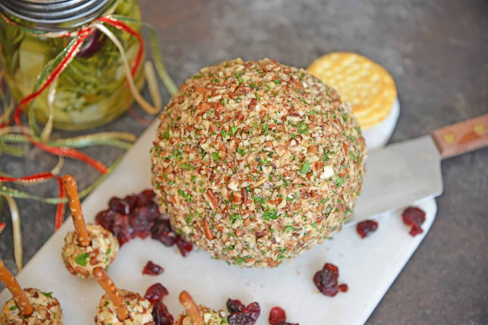 This cheese ball with cream cheese is a classic Party Cheese Ball recipe, made with simple ingredients. A must-make for any and all parties! #partycheeseballrecipe #creamcheeseball www.savoryexperiments.com