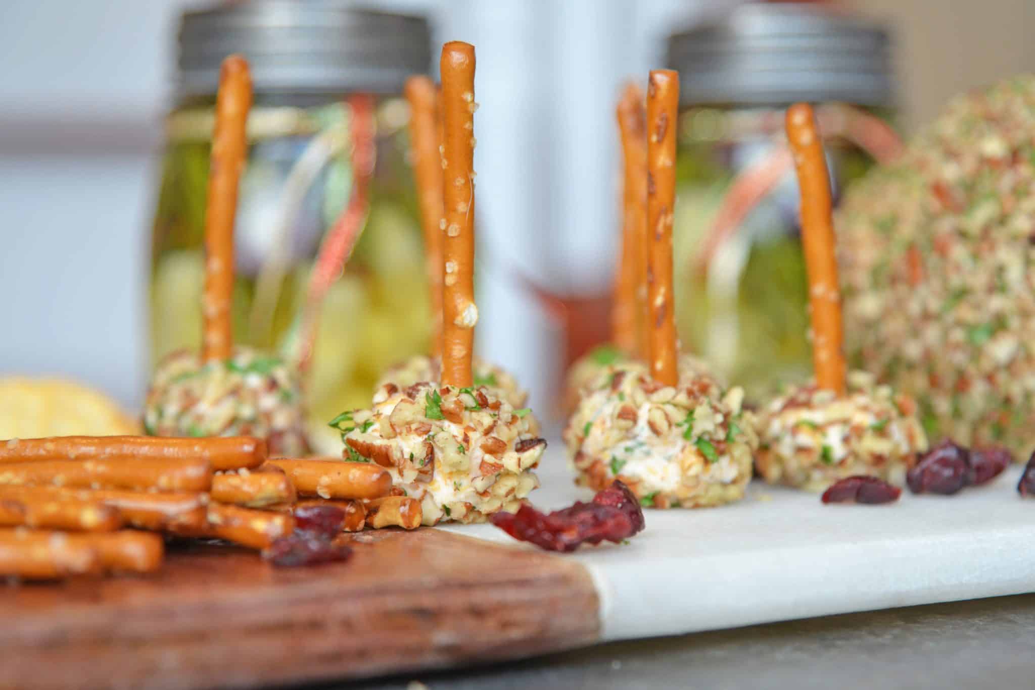 This cheese ball with cream cheese is a classic Party Cheese Ball recipe, made with simple ingredients. A must-make for any and all parties! #partycheeseballrecipe #creamcheeseball www.savoryexperiments.com