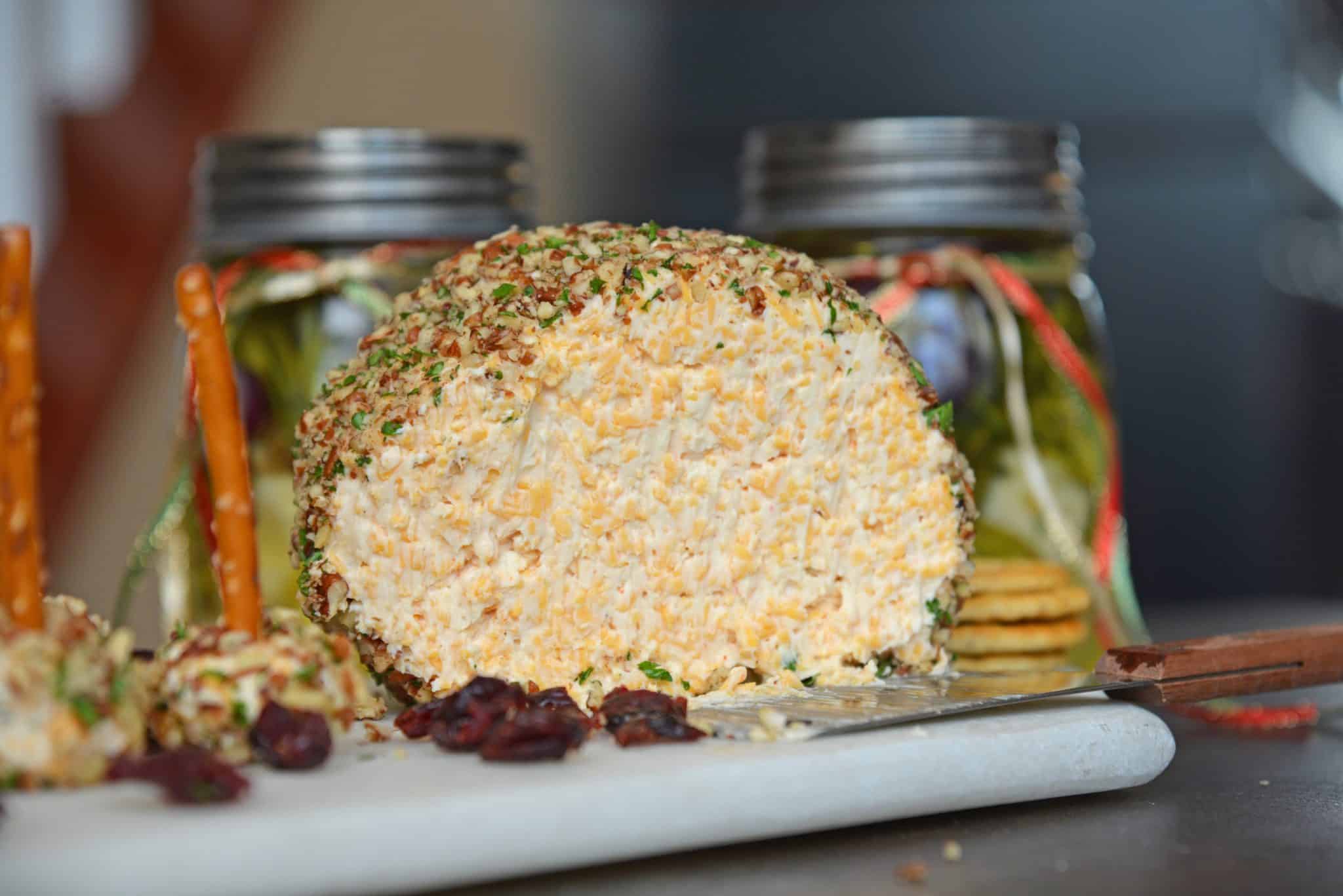 This cheese ball with cream cheese is a classic Party Cheese Ball recipe, made with simple ingredients. A must-make for any and all parties! #partycheeseballrecipe #creamcheeseball www.savoryexperiments.com