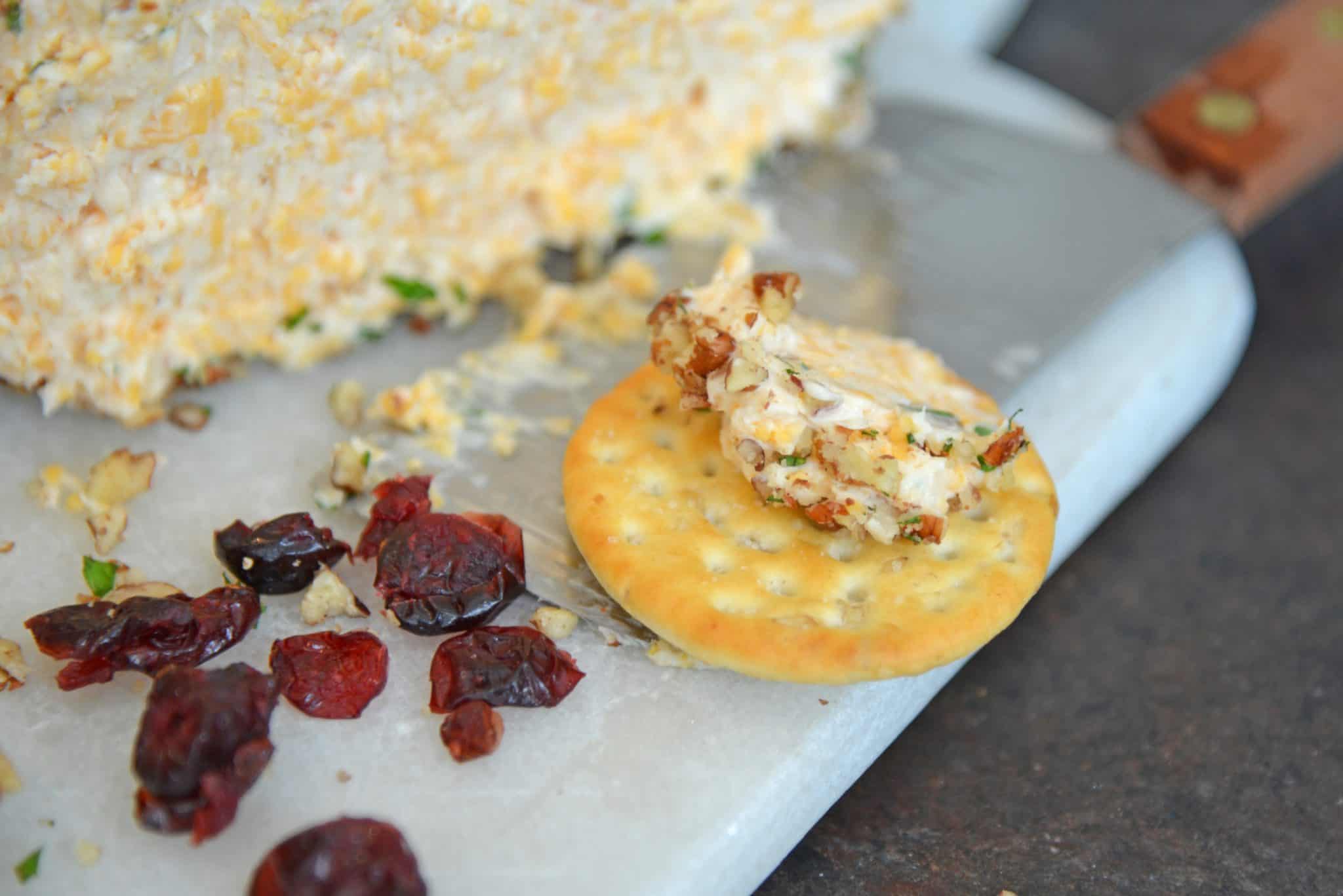 This cheese ball with cream cheese is a classic Party Cheese Ball recipe, made with simple ingredients. A must-make for any and all parties! #partycheeseballrecipe #creamcheeseball www.savoryexperiments.com