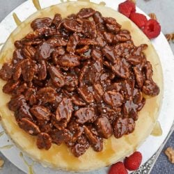 Pecan Pie Cheesecake is the perfect combination of two classic desserts - chocolate pecan pie and cheesecake. You'll want this on your holiday dessert menu! #chocolatepecanpie #pecanpiecheesecake #bestcheesecakerecipe www.savoryexperiments.com