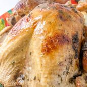 Juicy Roasted Turkey is easier than you think with my buttery recipe, a bottle of bubbles and fresh herbs. The best juicy turkey recipe ever! #juicyroastedturkey #bestturkeyrecipe #thanksgivingturkey www.savoryexperiments.com