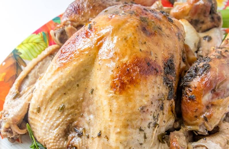 Juicy Roasted Turkey is easier than you think with my buttery recipe, a bottle of bubbles and fresh herbs. The best juicy turkey recipe ever! #juicyroastedturkey #bestturkeyrecipe #thanksgivingturkey www.savoryexperiments.com