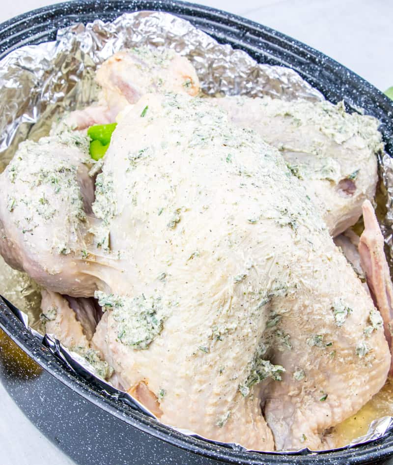 Juicy Roasted Turkey is easier than you think with my buttery recipe, a bottle of bubbles and fresh herbs. The best juicy turkey recipe ever! #juicyroastedturkey #bestturkeyrecipe #thanksgivingturkey www.savoryexperiments.com
