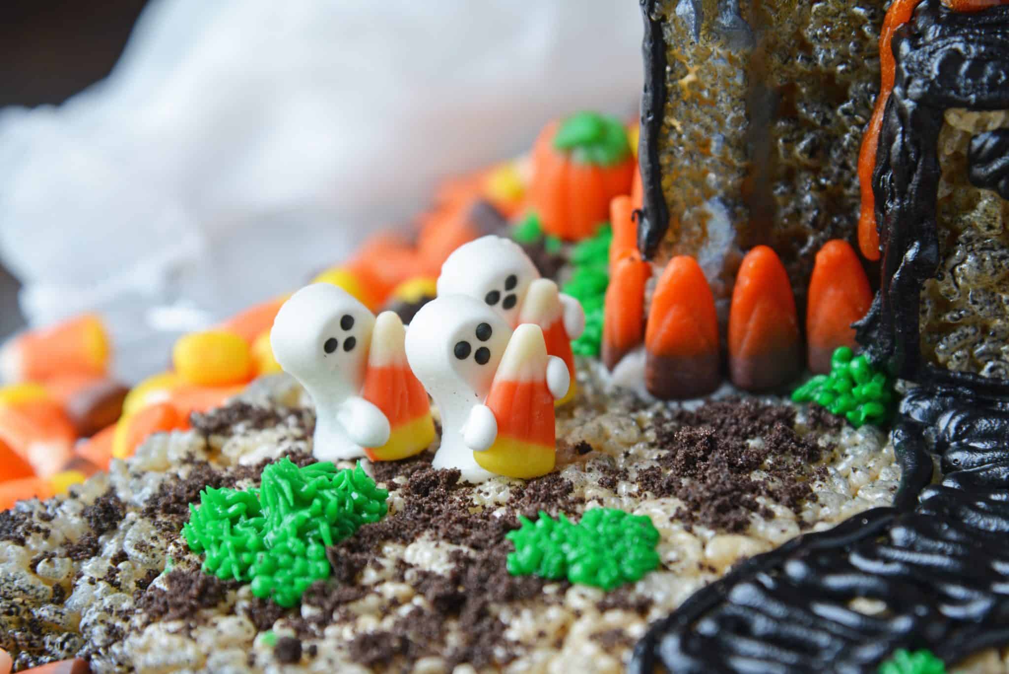 close up of ghosts holding candy corns