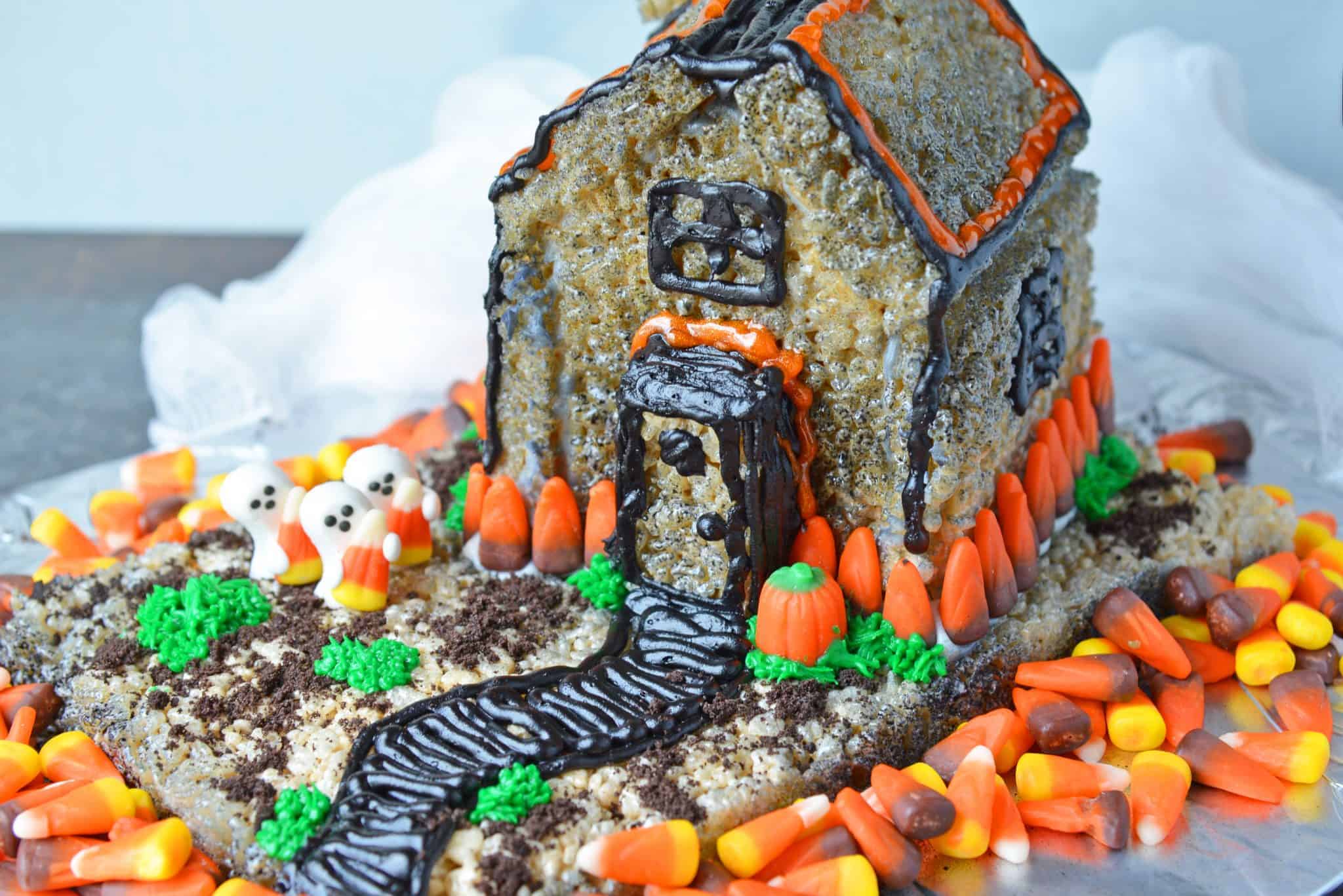 rice krispie treat haunted house surrounded by candy corn