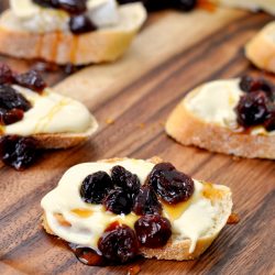 angled shot of cherry brie crostini