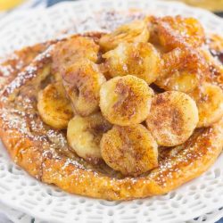 Cinnamon banana croissant french toast topped with bananas