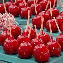 The classic candied apple is a beautifully colorful, glassy red apple. A lollipop candy coating with lush and slightly sour crunchy apple inside. #candiedapples www.savoryexperiments.com