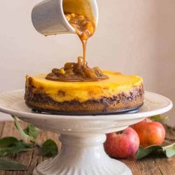 Maple caramel apple cheesecake on a pedestal