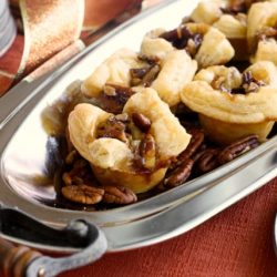 Maple pecan brie bites on a silver tray