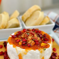 angled shot of sriracha apricot baked brie