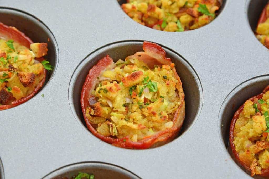 Bacon Wrapped Stuffing Muffins will become your favorite stuffing for Thanksgiving recipe. Who doesn't love stuffing with bacon?! #stuffingrecipe #stuffingforthanksgiving #stuffingmuffins www.savoryexperiments.com