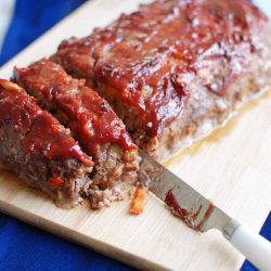 Green chile meatloaf on a cutting board
