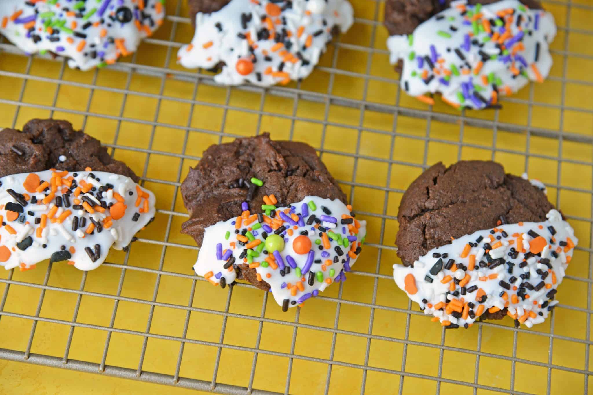 Halloween Chocolate Sugar Cookies combine soft sugar cookies with a delicious chocolate flavor, cookie icing and sprinkles for an easy Halloween dessert! #halloweencookies #chocolatesugarcookies #halloweendesserts www.savoryexperiments.com 