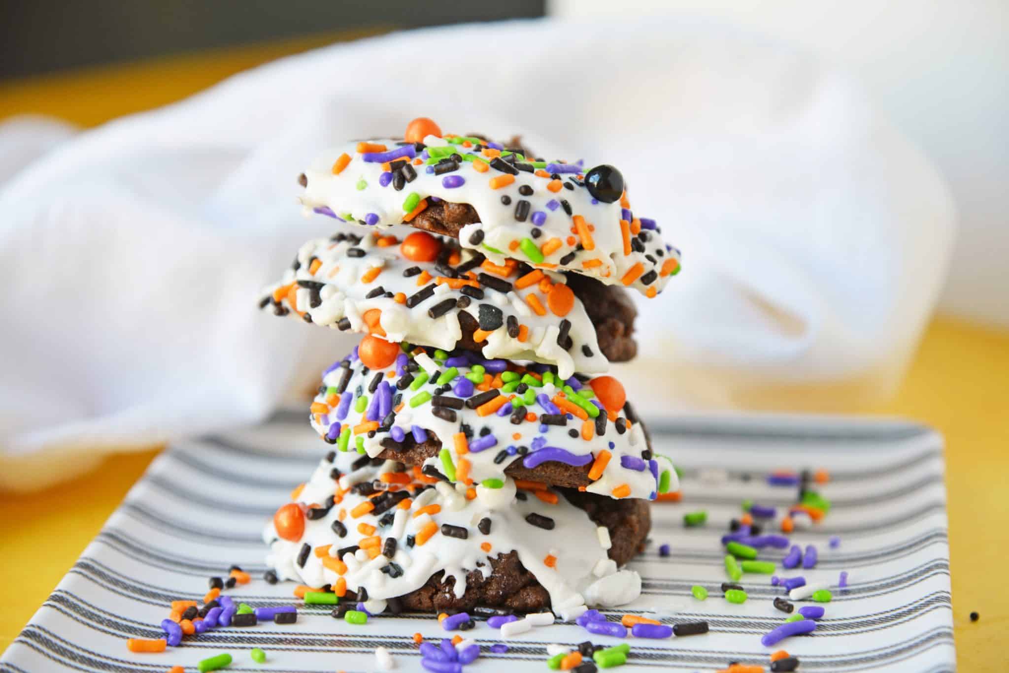 Halloween Chocolate Sugar Cookies combine soft sugar cookies with a delicious chocolate flavor, cookie icing and sprinkles for an easy Halloween dessert! #halloweencookies #chocolatesugarcookies #halloweendesserts www.savoryexperiments.com 