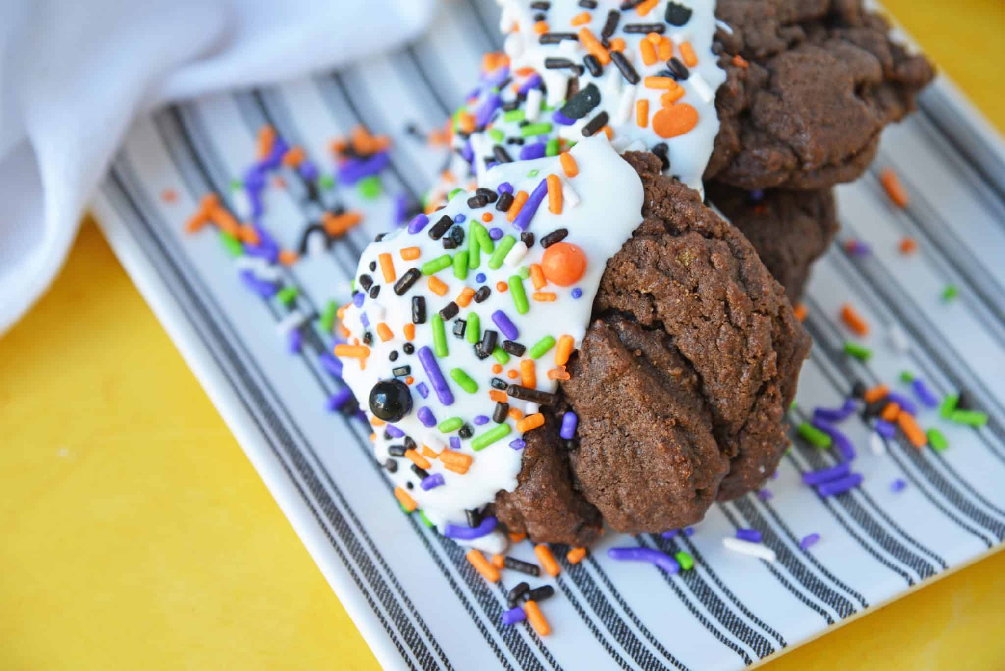 Halloween Chocolate Sugar Cookies combine soft sugar cookies with a delicious chocolate flavor, cookie icing and sprinkles for an easy Halloween dessert! #halloweencookies #chocolatesugarcookies #halloweendesserts www.savoryexperiments.com