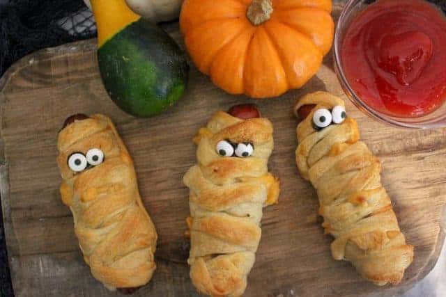 Spooky snacks for Halloween on a cutting board