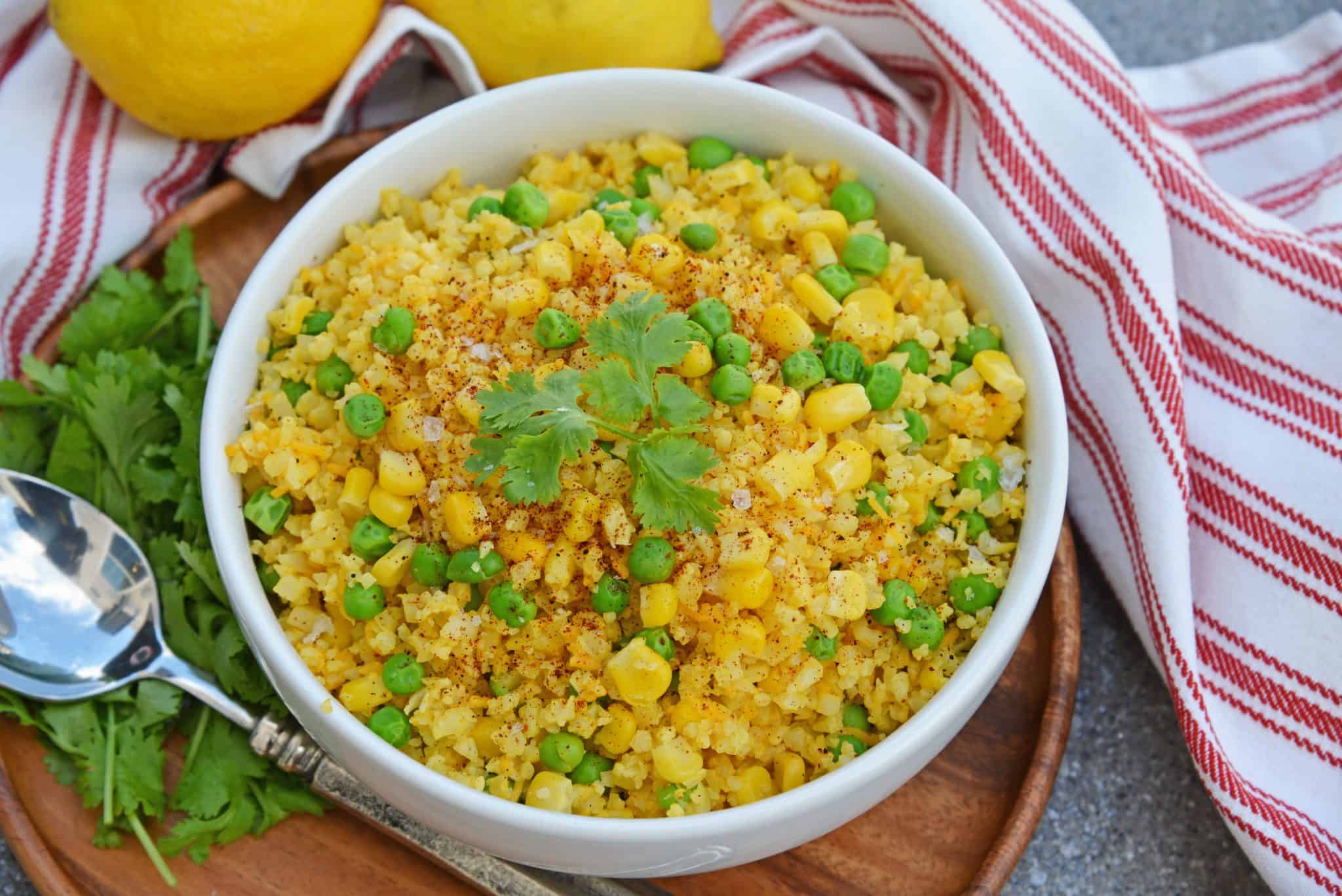 This Mexican Cauliflower Rice recipe is a deliciously easy and cheesy cauliflower rice made with simple ingredients and lots of flavor. #cheesycauliflowerrice #cauliflowerricerecipe #mexicancauliflowerrice www.savoryexperiments.com