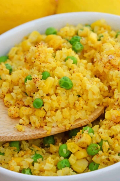 This Mexican Cauliflower Rice recipe is a deliciously easy and cheesy cauliflower rice made with simple ingredients and lots of flavor. #cheesycauliflowerrice #cauliflowerricerecipe #mexicancauliflowerrice www.savoryexperiments.com