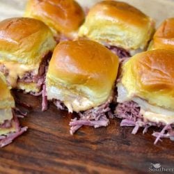 Reuben sliders on a wood cutting board