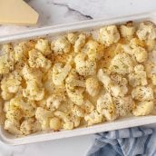 overhead of roasted cauliflower in a baking dish