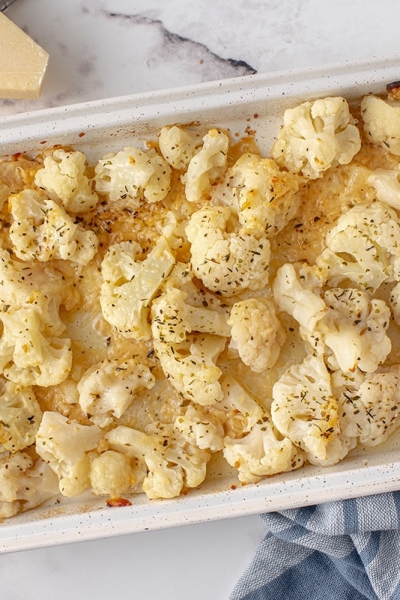 overhead of roasted cauliflower in a baking dish