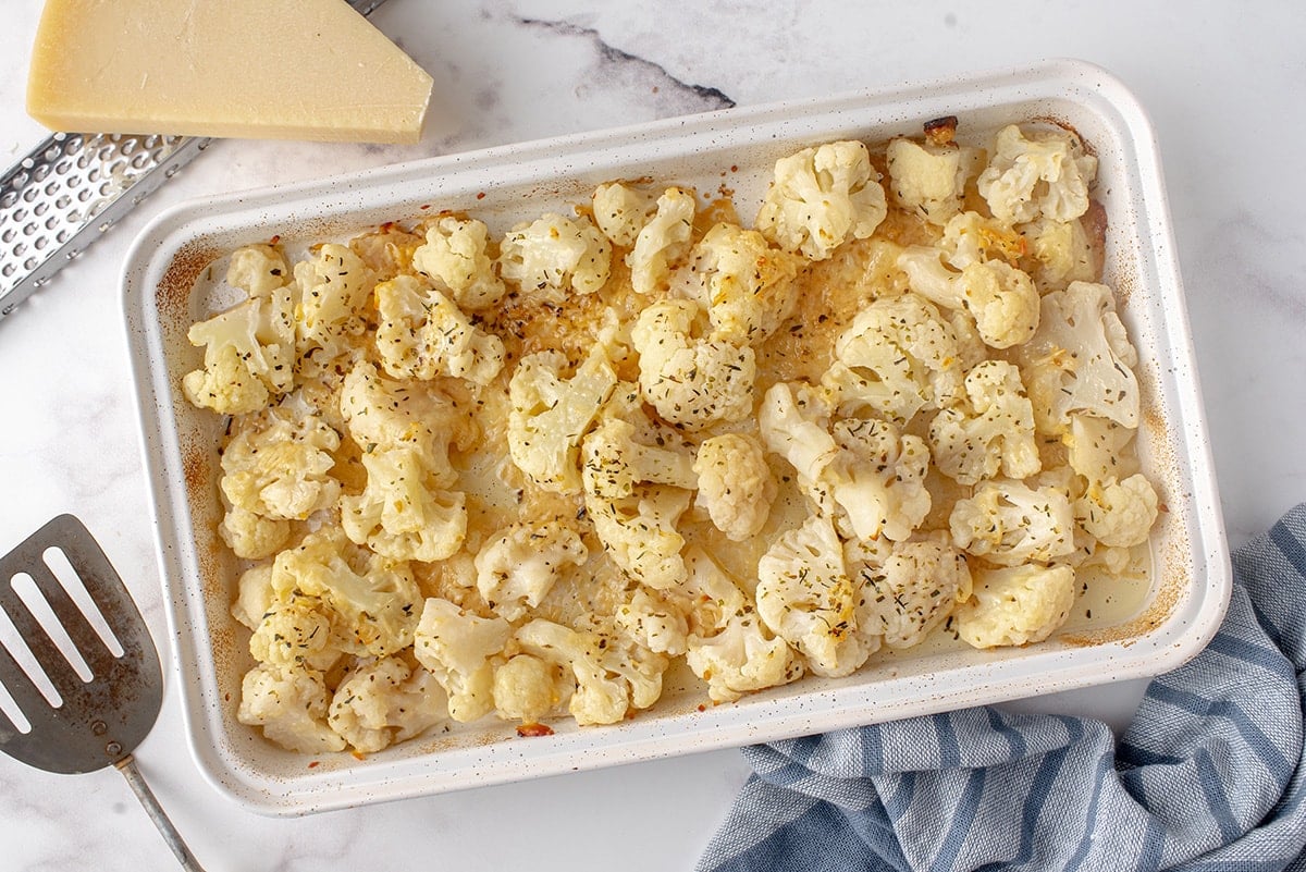 overhead of roasted cauliflower in a baking dish