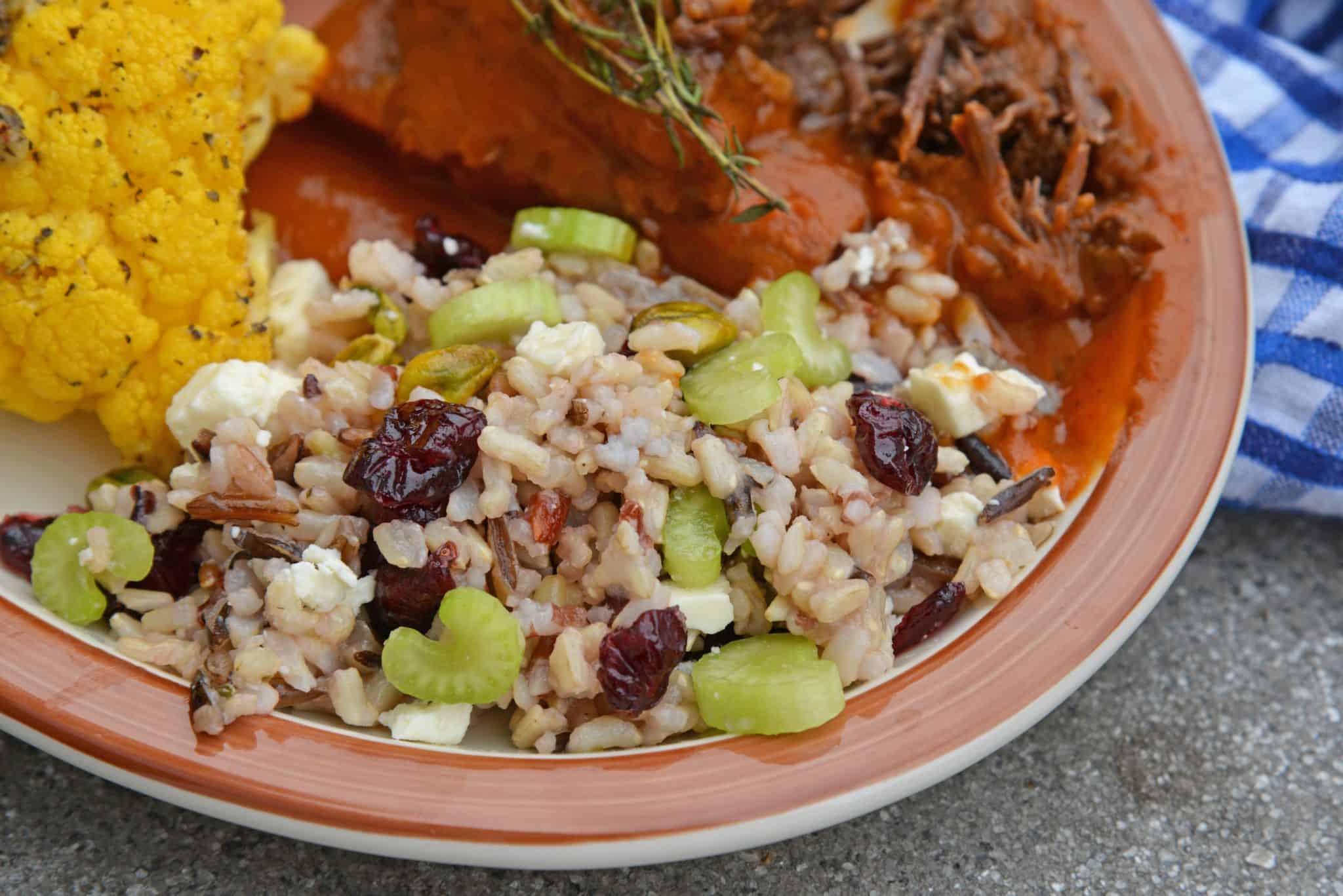 This Wild Rice Pilaf recipe is an easy side dish for your next potluck, picnic or dinner. Quick and easy to make in advance it's the best rice pilaf recipe! #wildricepilaf #ricepilafrecipe www.savoryexperiments.com