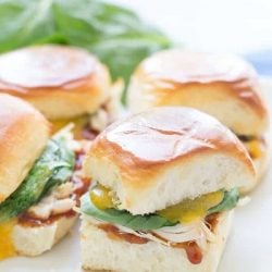 BBQ chicken sliders on a white plate