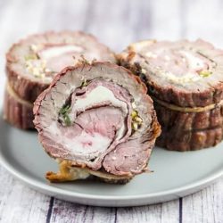 Italian flank steak pinwheel recipes on a white plate