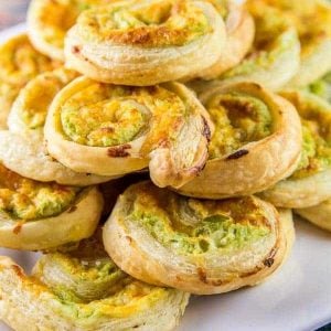 Jalapeno popper pinwheel recipes stacked on a white plate
