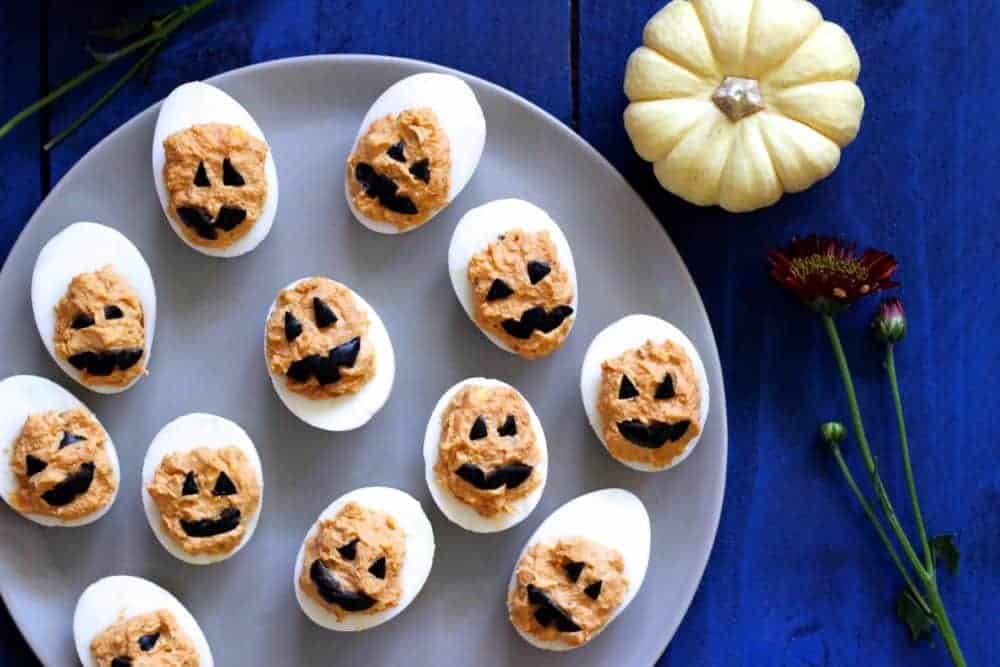 Jack-O-Lantern Deviled Eggs on a tray