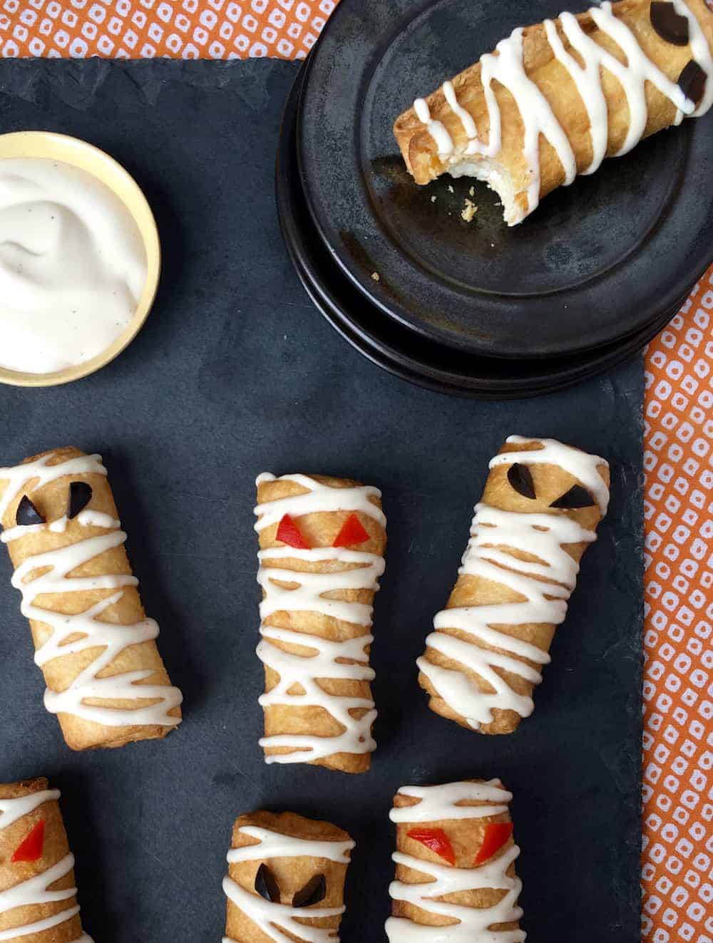 Cute Snacks for Halloween as pizza roll up mummies