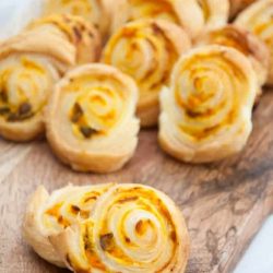 Pumpkin basil pinwheel recipes on a cutting board