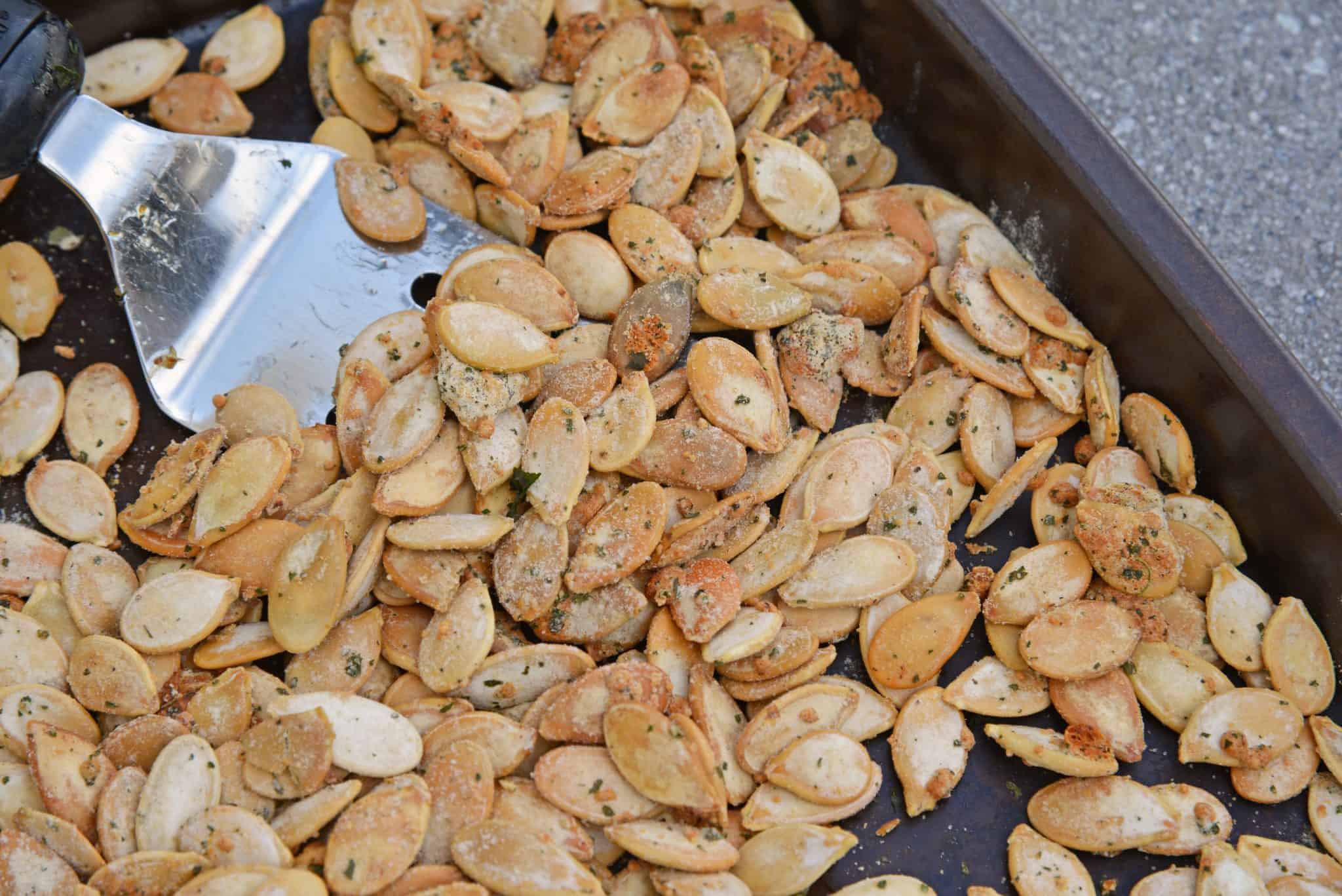 Ranch Pumpkin Seeds take roasted pumpkin seeds to a whole new level. With only 3 ingredients, they're an easy and delicious fall snack! #roastedpumpkinseeds #ranchpumpkinseeds www.savoryexperiments.com