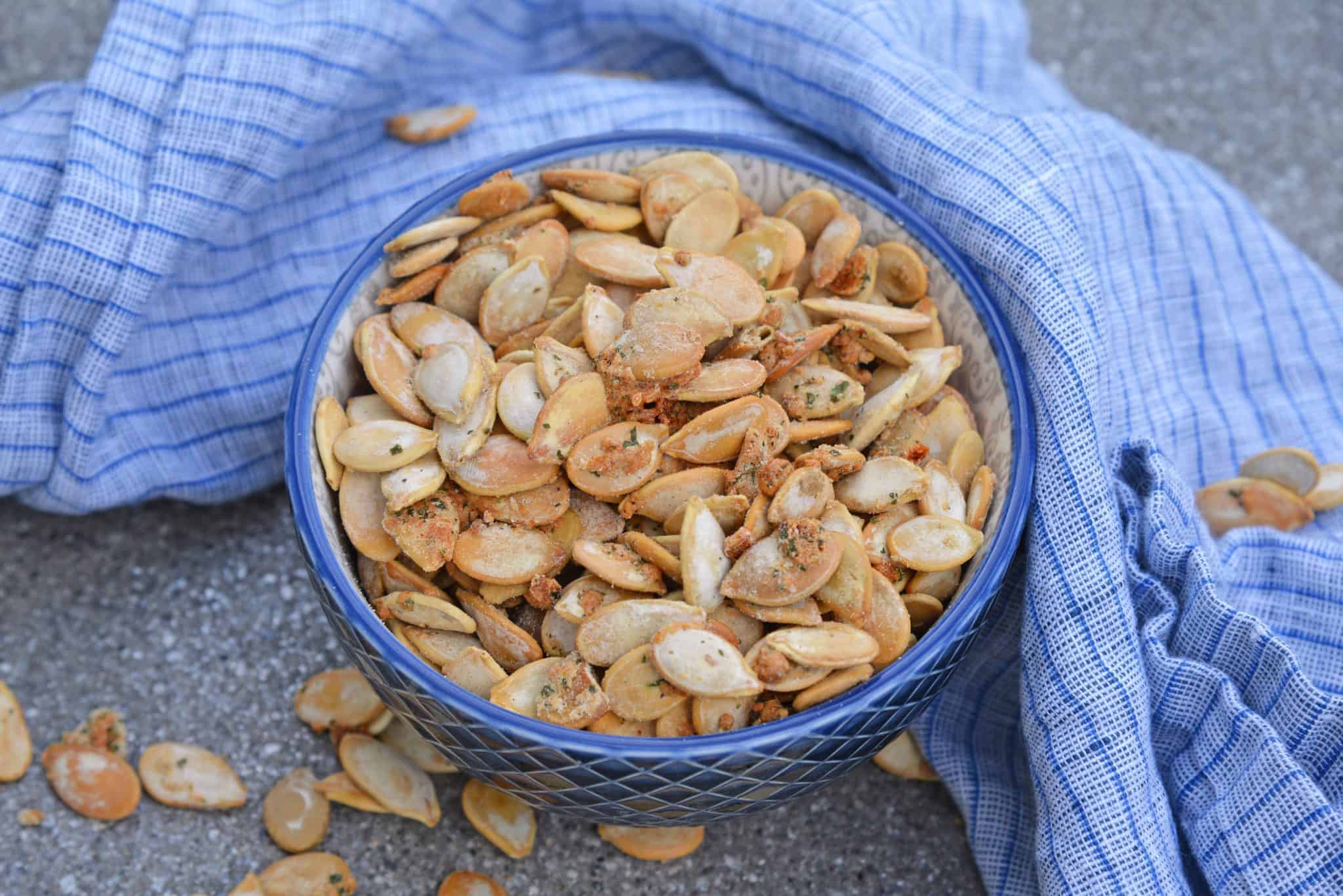 Ranch Pumpkin Seeds take roasted pumpkin seeds to a whole new level. With only 3 ingredients, they're an easy and delicious fall snack! #roastedpumpkinseeds #ranchpumpkinseeds www.savoryexperiments.com