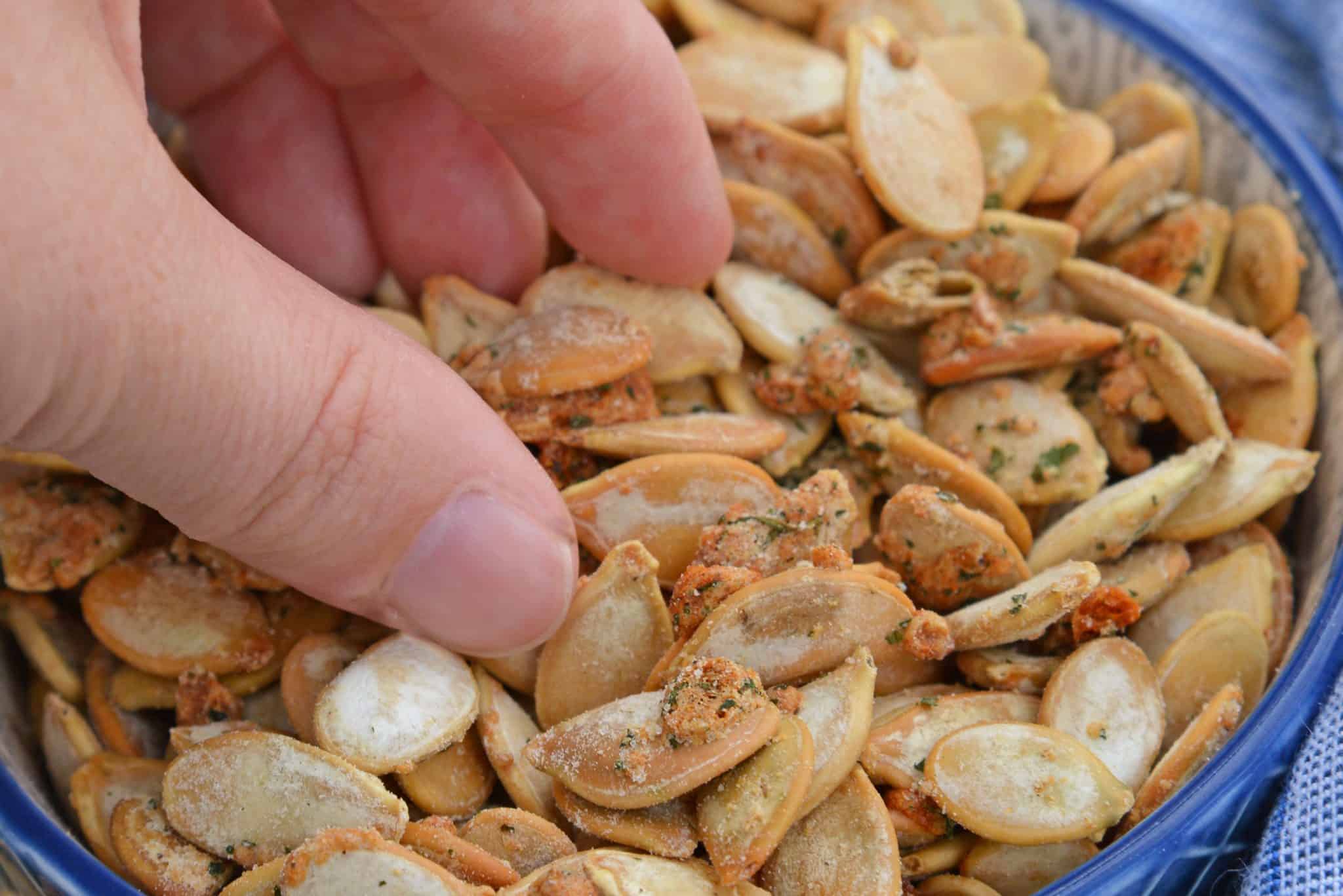 Ranch Pumpkin Seeds take roasted pumpkin seeds to a whole new level. With only 3 ingredients, they're an easy and delicious fall snack! #roastedpumpkinseeds #ranchpumpkinseeds www.savoryexperiments.com