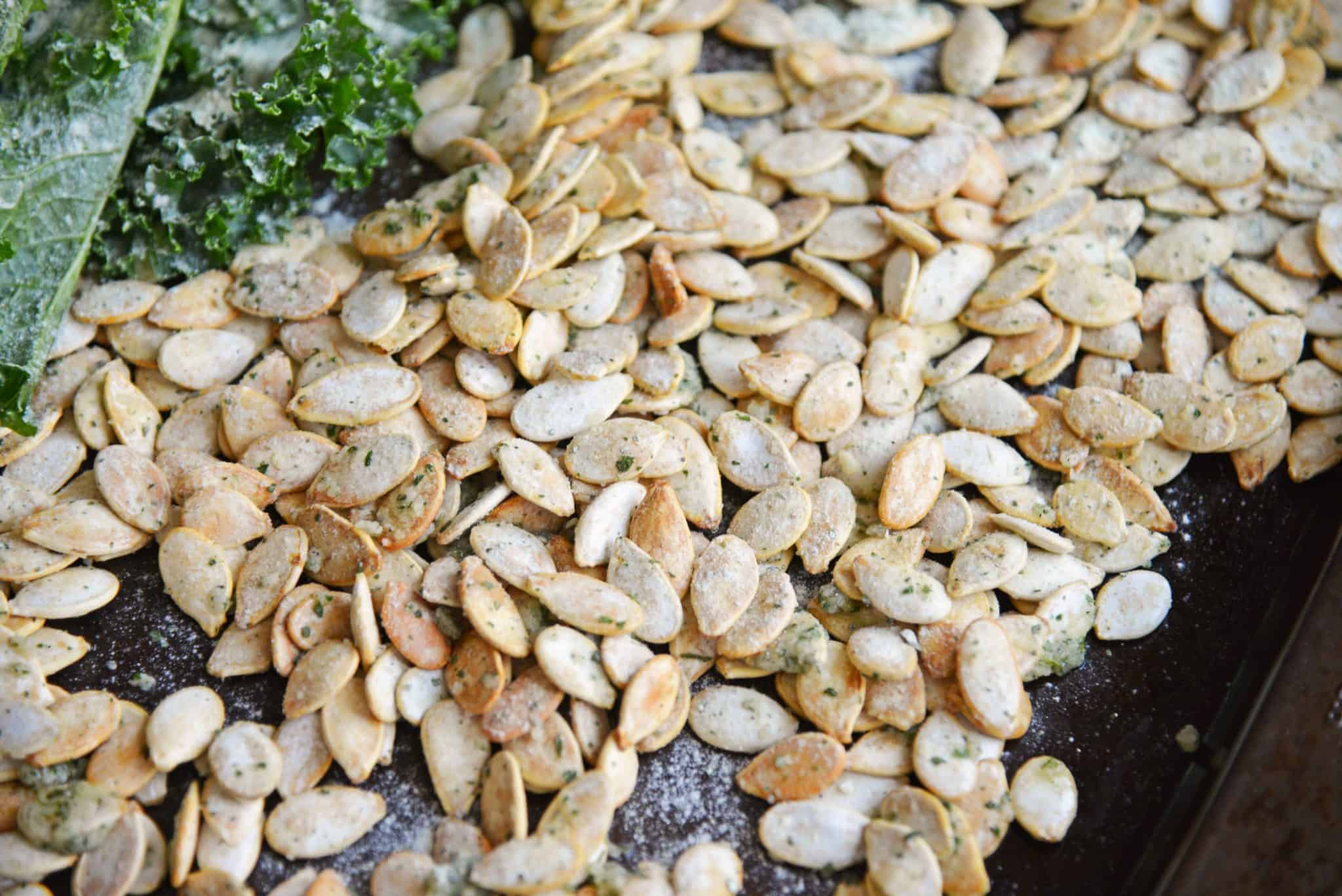 Ranch Pumpkin Seeds take roasted pumpkin seeds to a whole new level. With only 3 ingredients, they're an easy and delicious fall snack! #roastedpumpkinseeds #ranchpumpkinseeds www.savoryexperiments.com