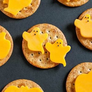 Ghost cheese on crackers as snacks for Halloween