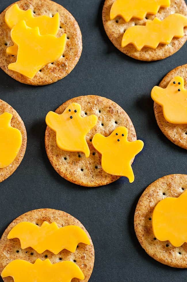 Ghost cheese on crackers as snacks for Halloween