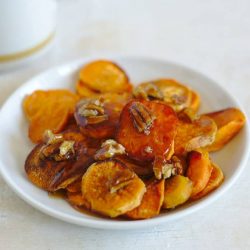 Thanksgiving sides melting sweet potatoes in a white bowl