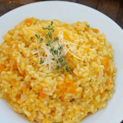 Butternut Squash Risotto is an easy side dish or entrée made with Arborio rice, crisp white cooking wine, sweet roasted butternut squash and fresh thyme. #risottorecipes #butternutsquash www.savoryexperiments.com