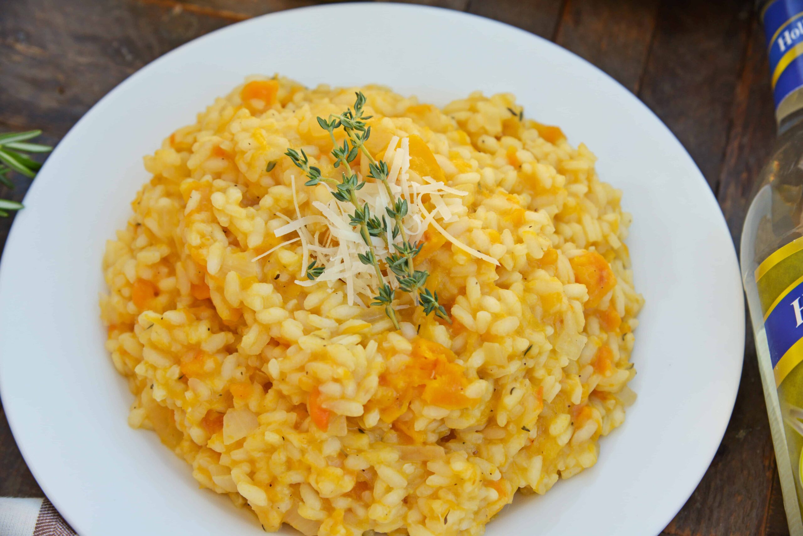 Butternut Squash Risotto is an easy side dish or entrée made with Arborio rice, crisp white cooking wine, sweet roasted butternut squash and fresh thyme. #risottorecipes #butternutsquash www.savoryexperiments.com