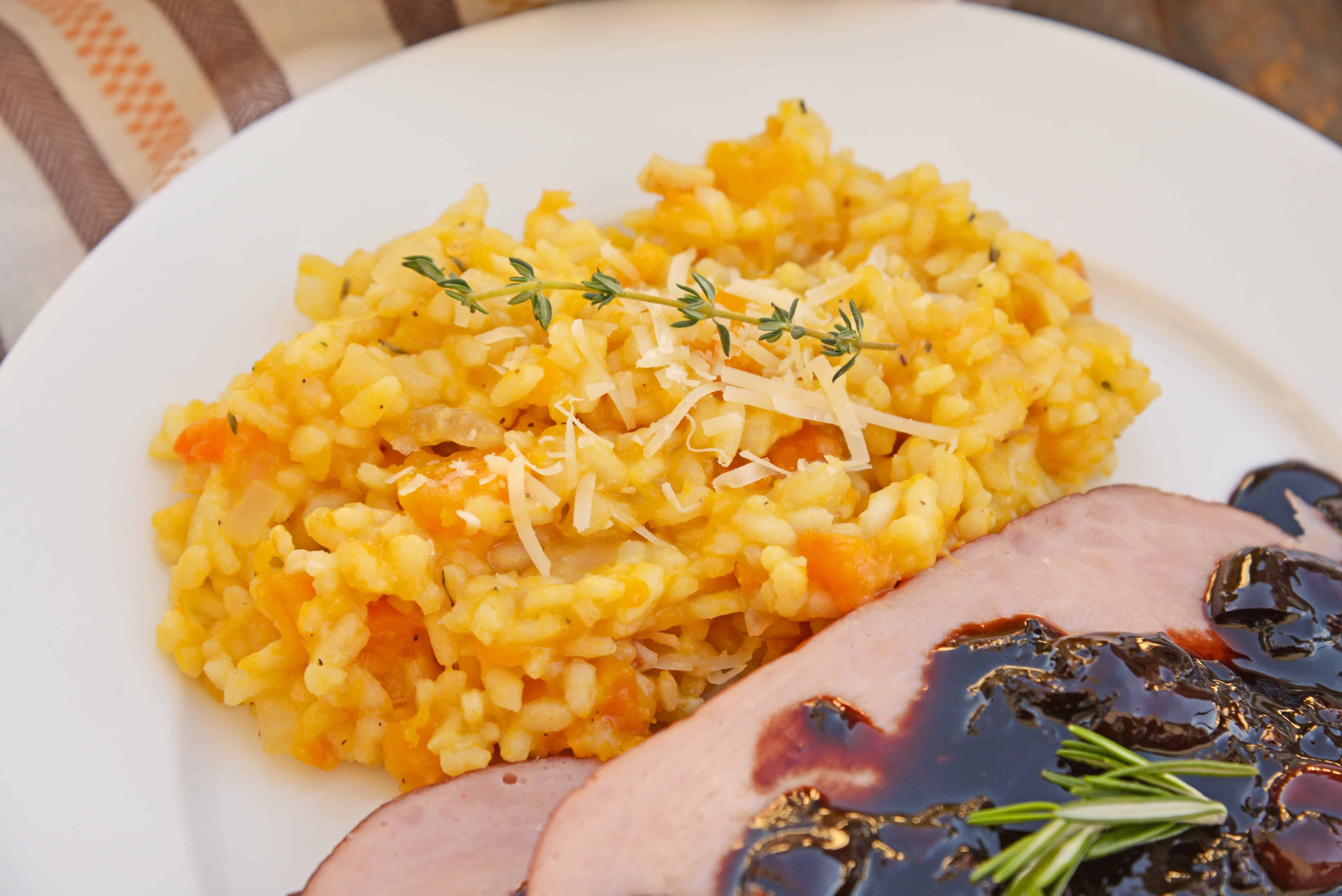 Butternut Squash Risotto is an easy side dish or entrée made with Arborio rice, crisp white cooking wine, sweet roasted butternut squash and fresh thyme. #risottorecipes #butternutsquash www.savoryexperiments.com 