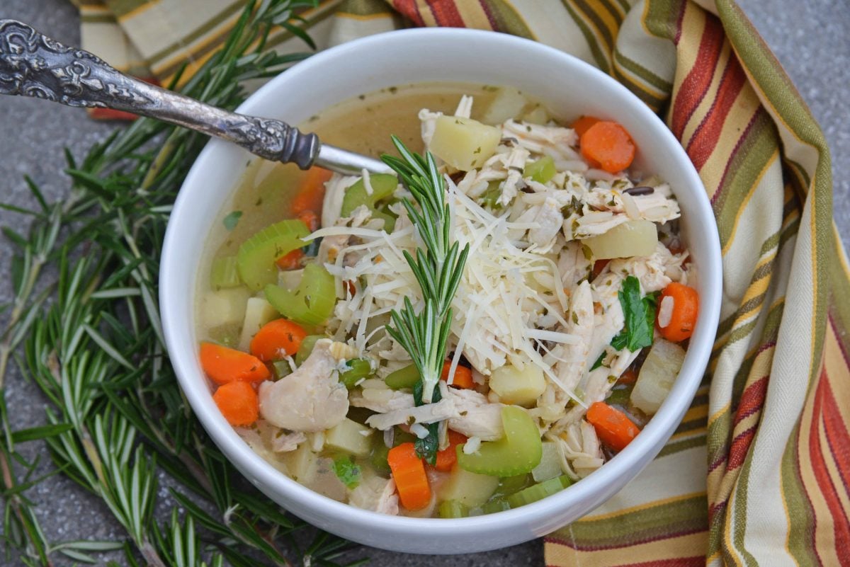 This 20-Minute Wild Rice Chicken Soup is an incredibly easy but flavorful 20 minute meal made with two kitchen hacks that will make your life so much easier! It'll become a winter soup staple in your home! #chickensoup #chickenwildricesoup www.savoryexperiments.com