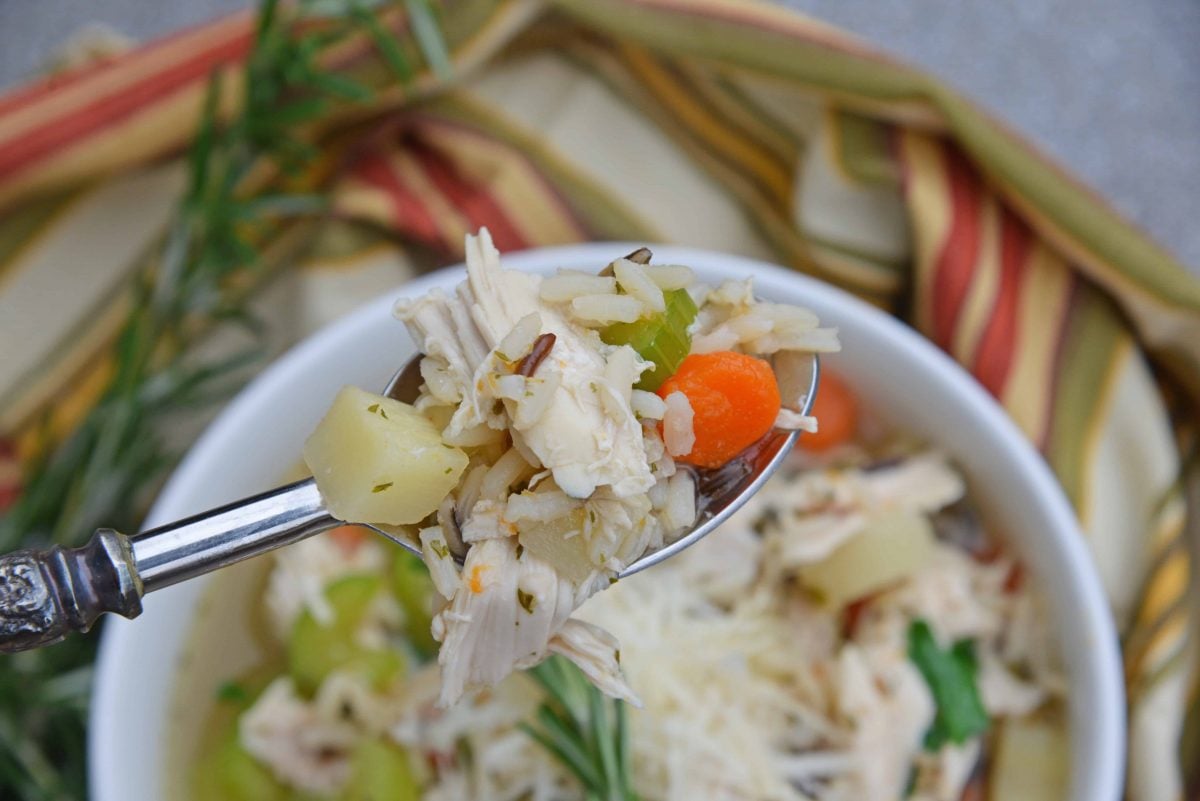 This 20-Minute Wild Rice Chicken Soup is an incredibly easy but flavorful 20 minute meal made with two kitchen hacks that will make your life so much easier! It'll become a winter soup staple in your home! #chickensoup #chickenwildricesoup www.savoryexperiments.com