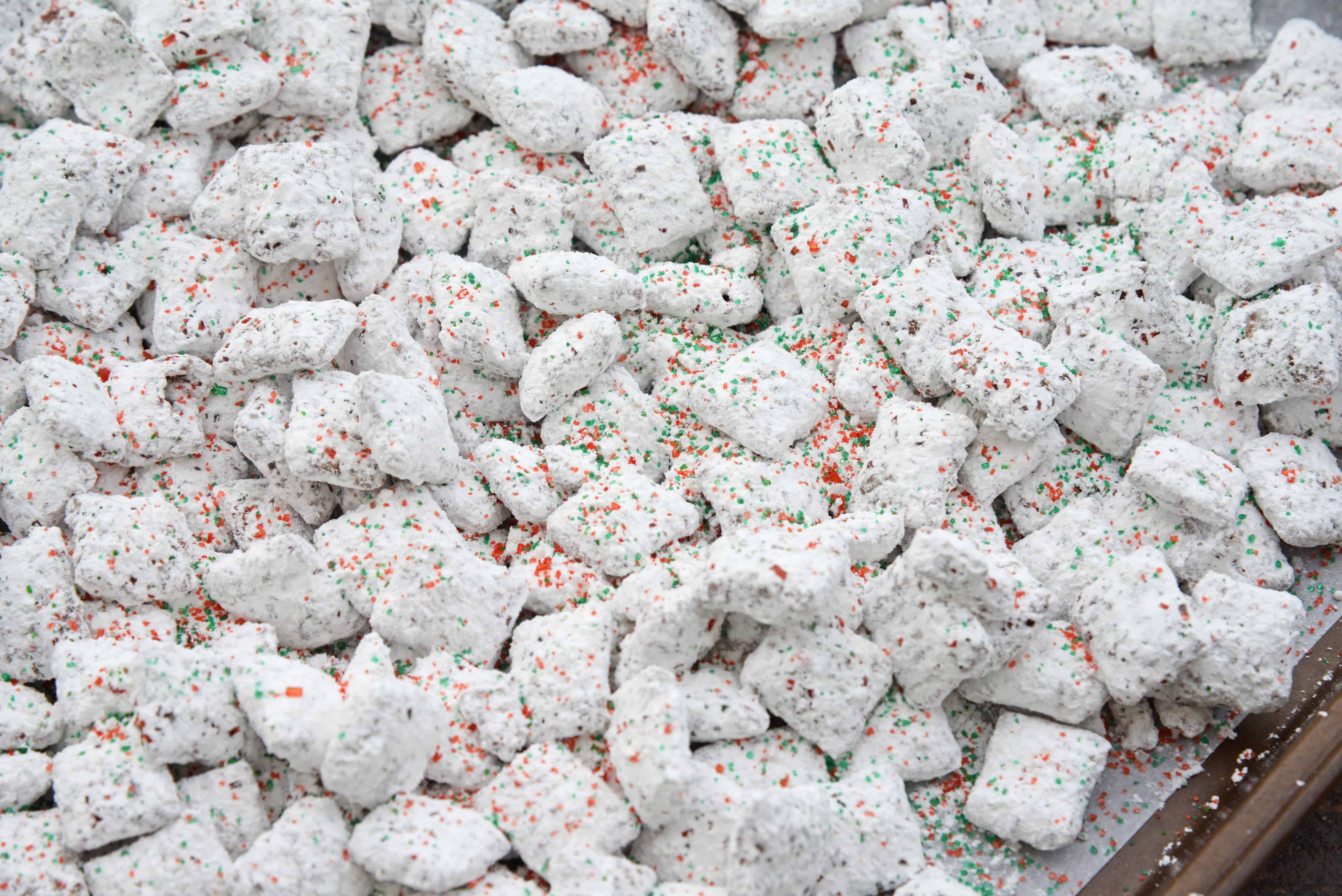 Christmas Puppy Chow transforms a traditional muddy buddy recipe into a festive Reindeer Chow mix! The perfect no-bake dessert for any party or event. #puppychow #reindeerchow #muddybuddy www.savoryexperiments.com
