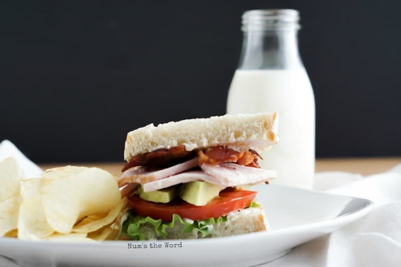 Turkey BLT on a white plate - leftover turkey recipes